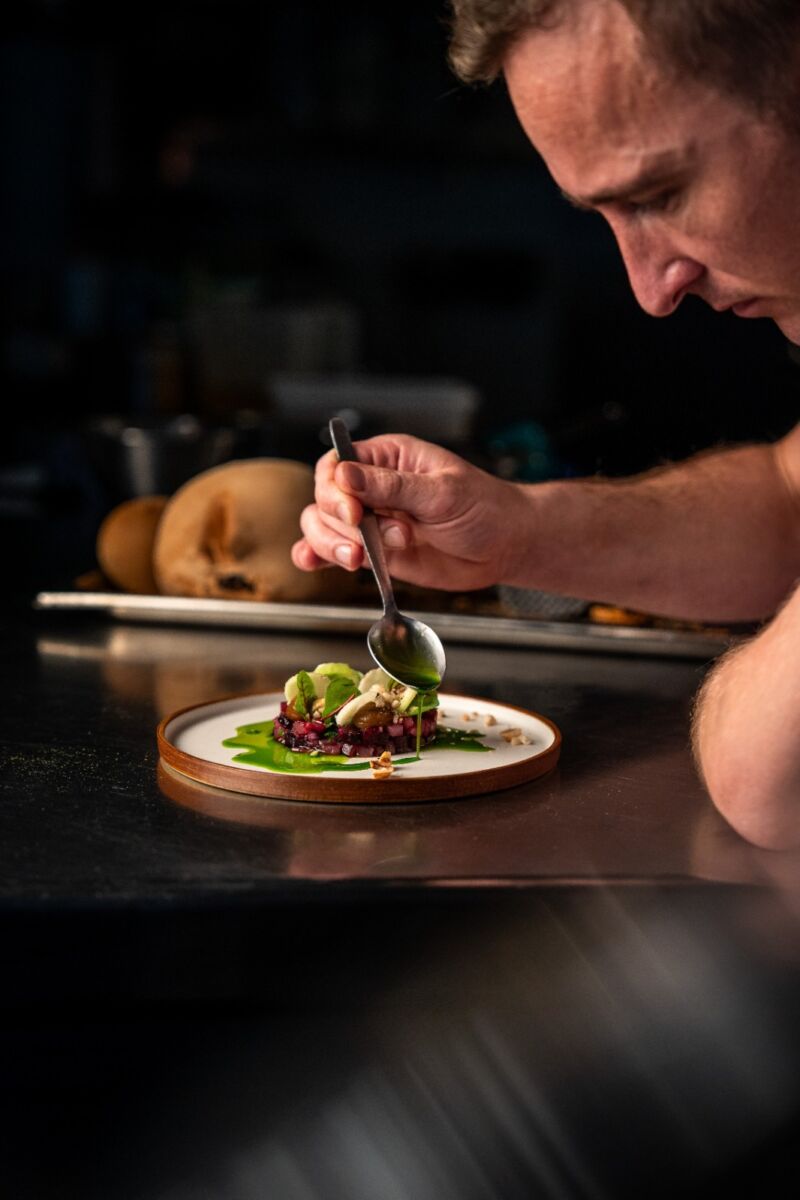 Head Chef James putting details on a dish