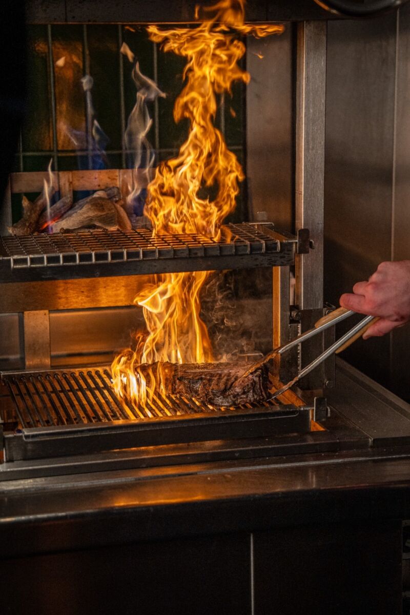 Cooking steak on a fire