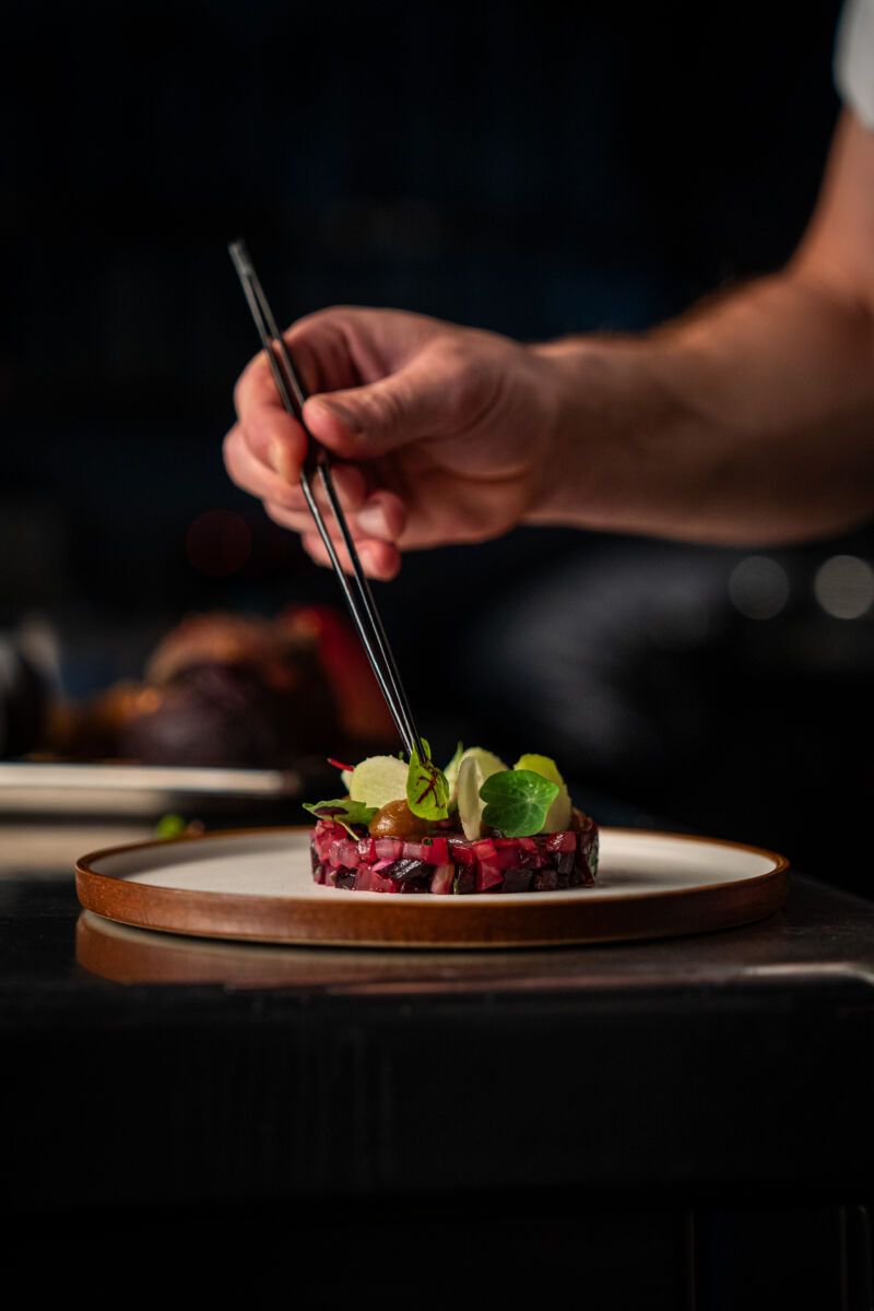 Chef putting final details to a dish.