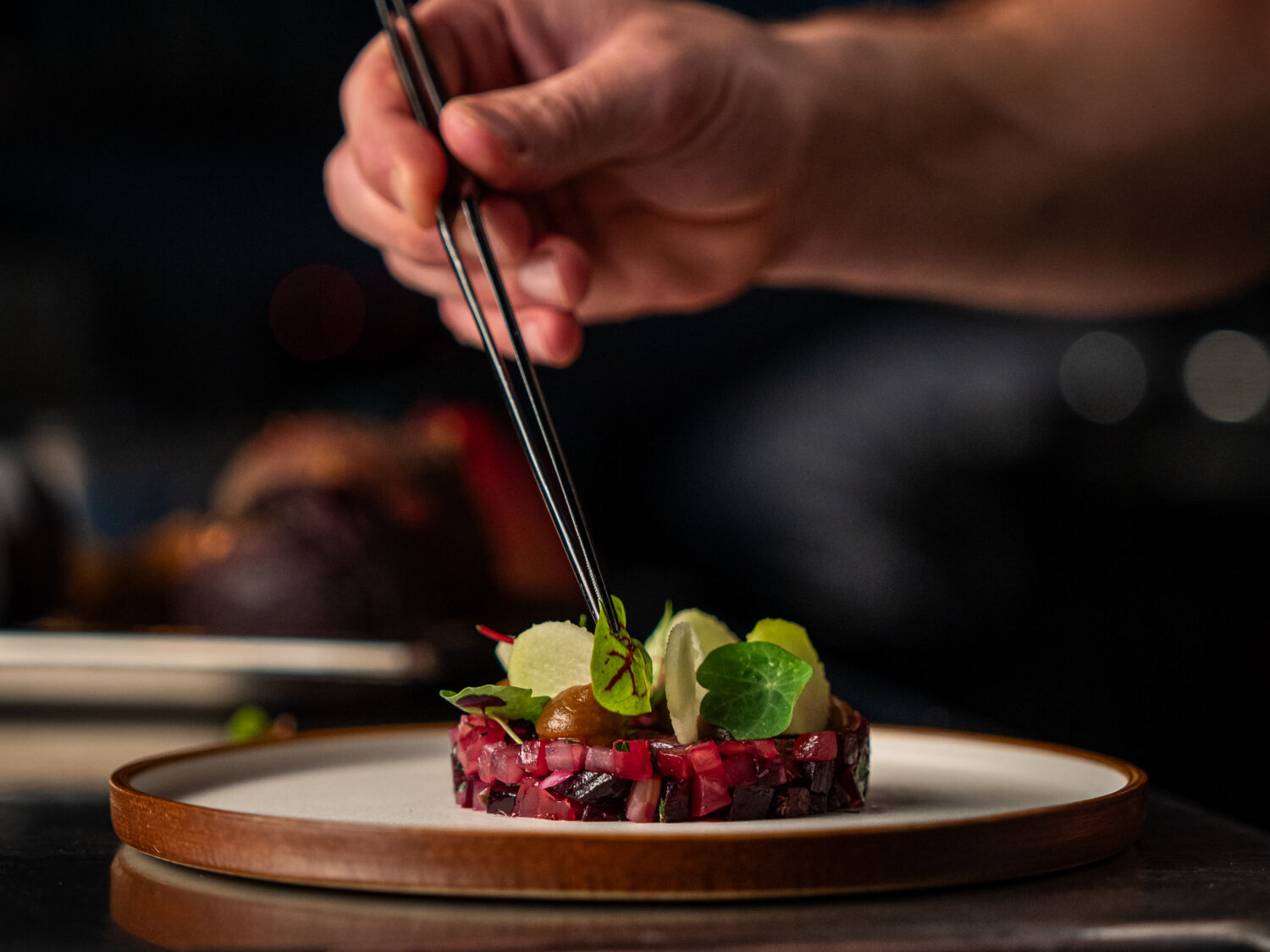 Chef putting final touches on a dish